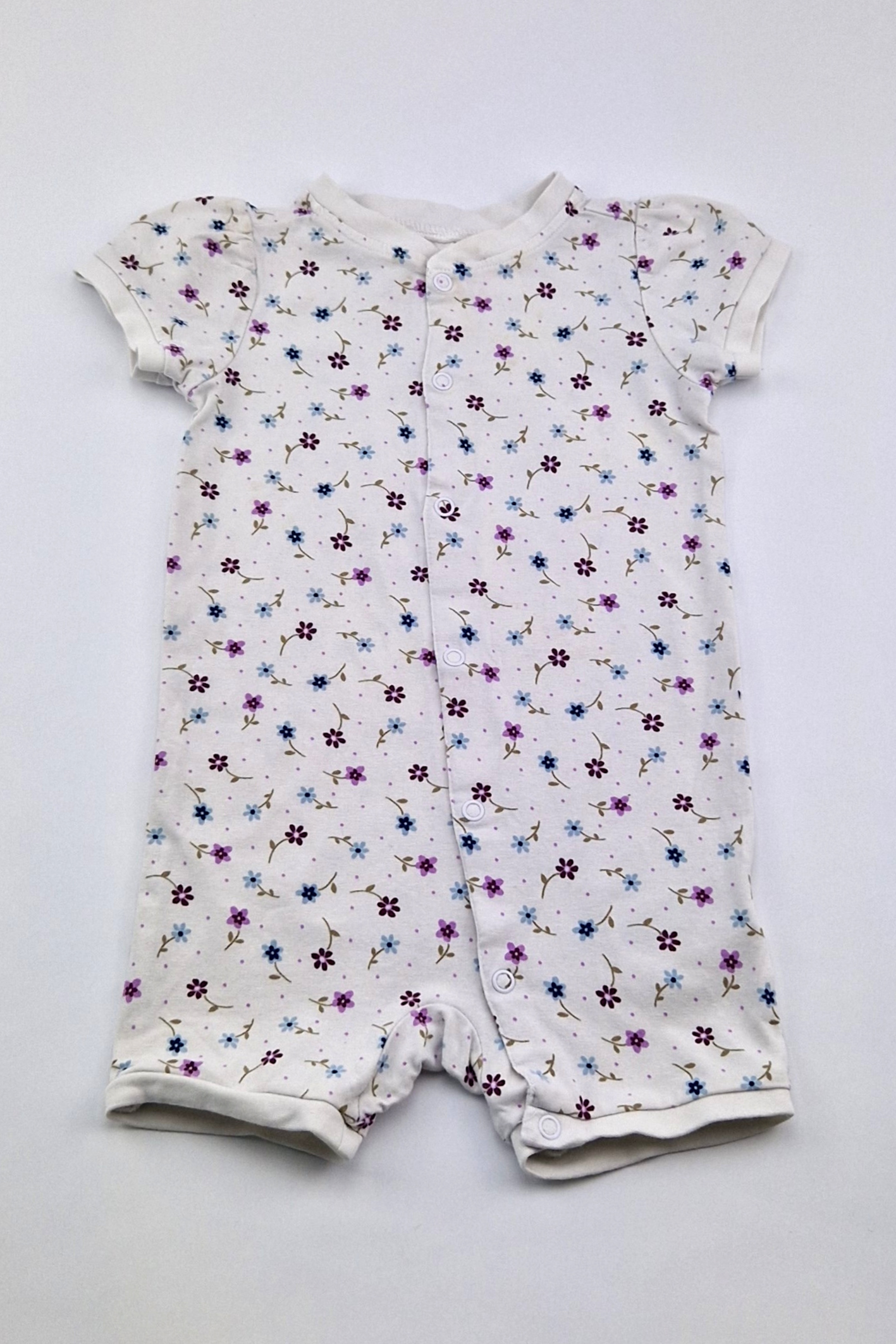 6–9 Monate – Strampler mit Blumenmuster (H&M)